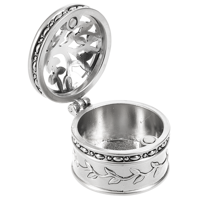 Silver decorative  tree of  life boc charm container with open lid on a white background