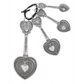 Silver key-shaped keychain with heart designs on a white background