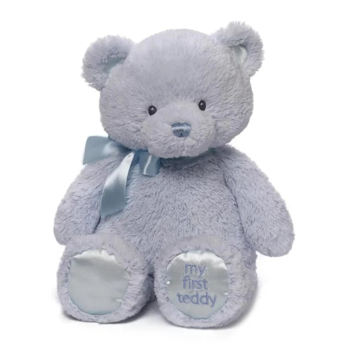 Blue teddy bear with a heart that says 'my first teddy' 15" on a white background