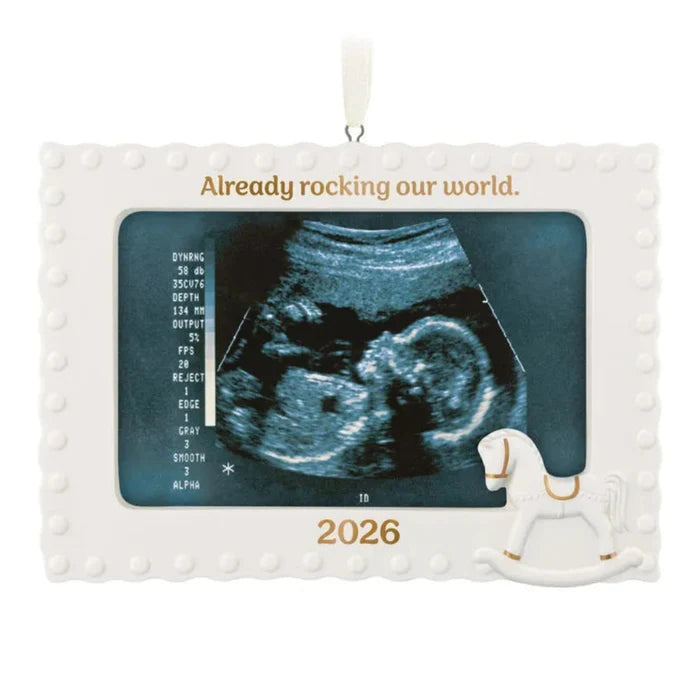 Decorative ornament with ultrasound image and '2026' text, featuring a rocking horse.