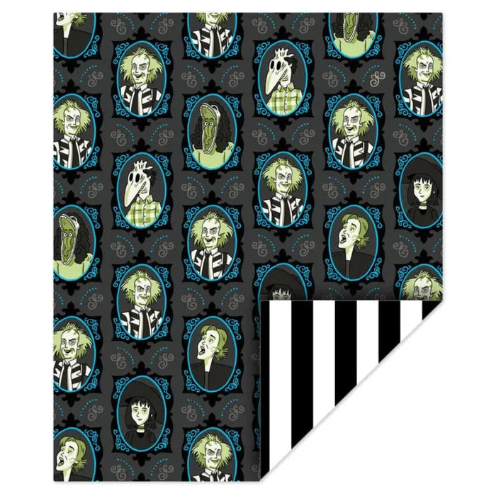 Digital image of Glow-in-the-dark Beetlejuice fleece blanket featuring black and gray framed portraits of Beetlejuice, Lydia, Delia, Barbara, and Adam, with green glowing accents and a black-and-white striped back.