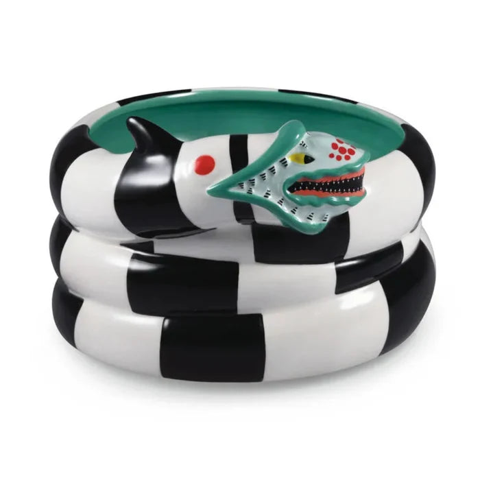 Beetlejuice-themed candy bowl shaped like a black and white striped sandworm with two heads, coiled and ready to carry some fun spooky candy, on a white background .