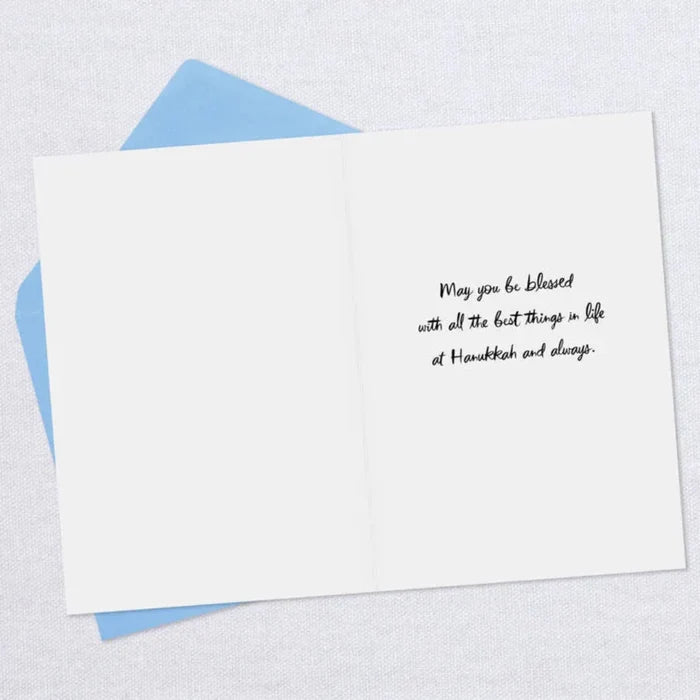 White card with black text on a light blue envelope against a white background
