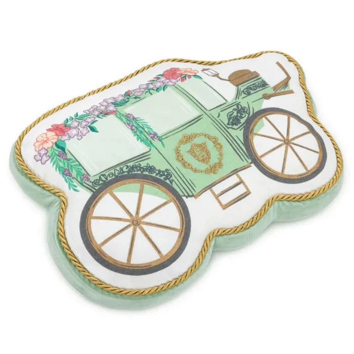 Carriage-shaped Bridgerton decorative pillow with a mint green illustrated carriage, floral garlands, gold rope trim, and vintage wheel details, photographed on a white background.