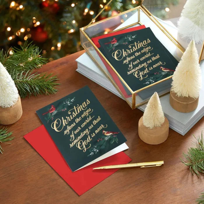 Christmas card with decorative text on a table with festive decorations
