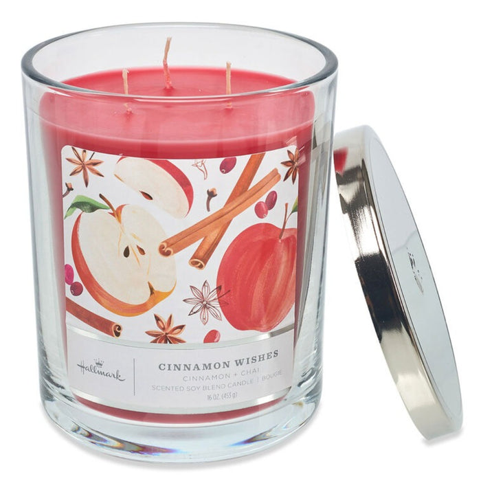Hallmark 3 wick Candle with cinnamon and apple design on the label, featuring a silver lid.