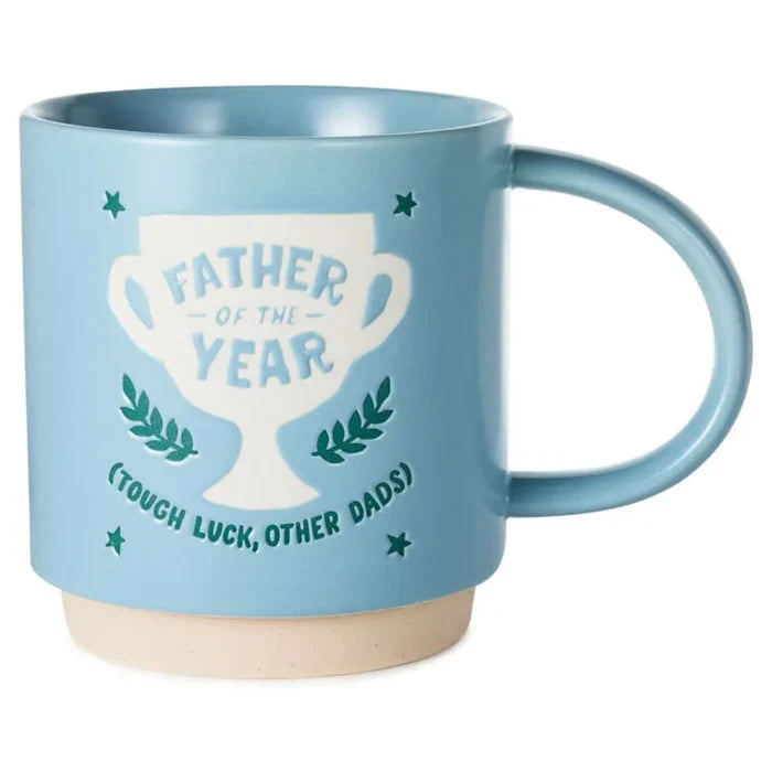 Blue mug with a trophy graphic and text on a white background