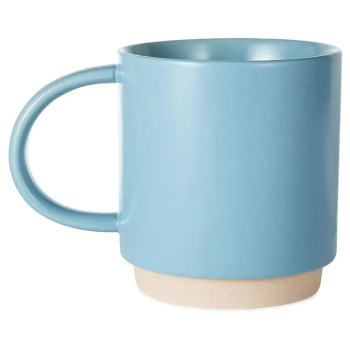 Blue mug with a beige base on a white background