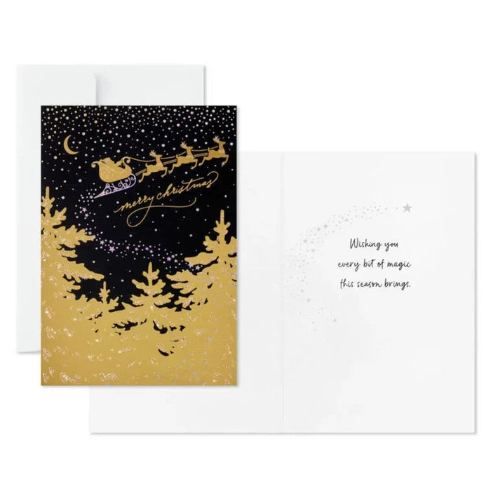 Christmas card with Santa Claus in a sleigh, trees, and 'Merry Christmas' text on a black background.