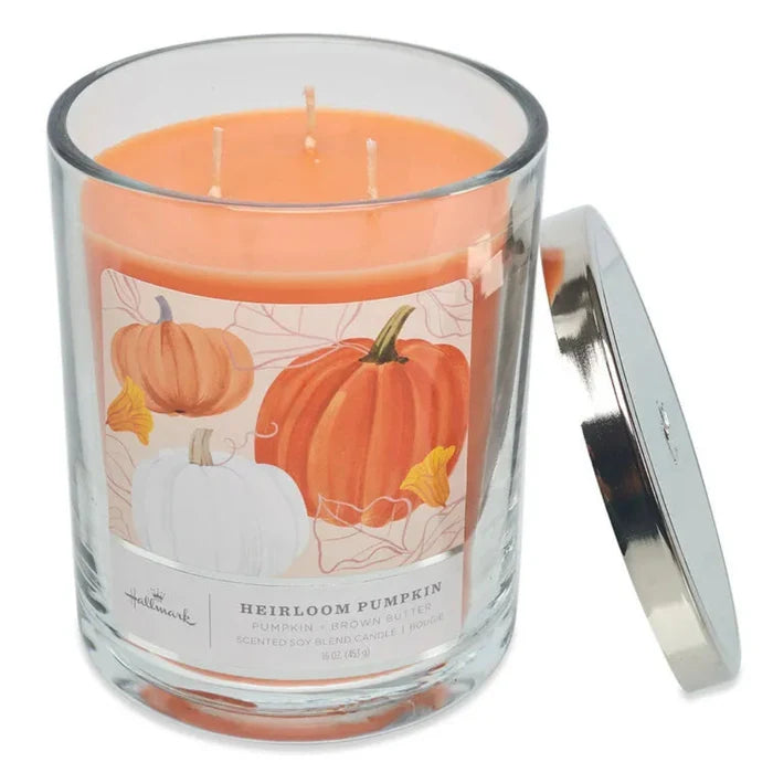 Hallmark 3 wick Candle in a glass jar with a pumpkin design label on a white background