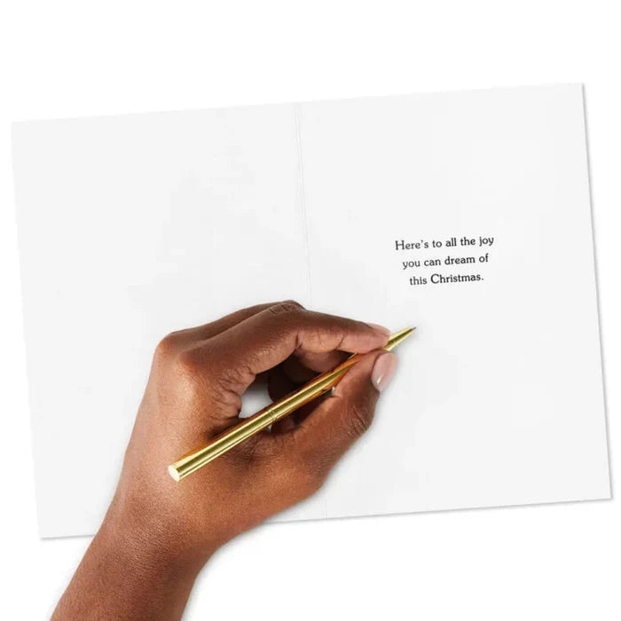 Hand holding a gold pen over a card with text on a white background