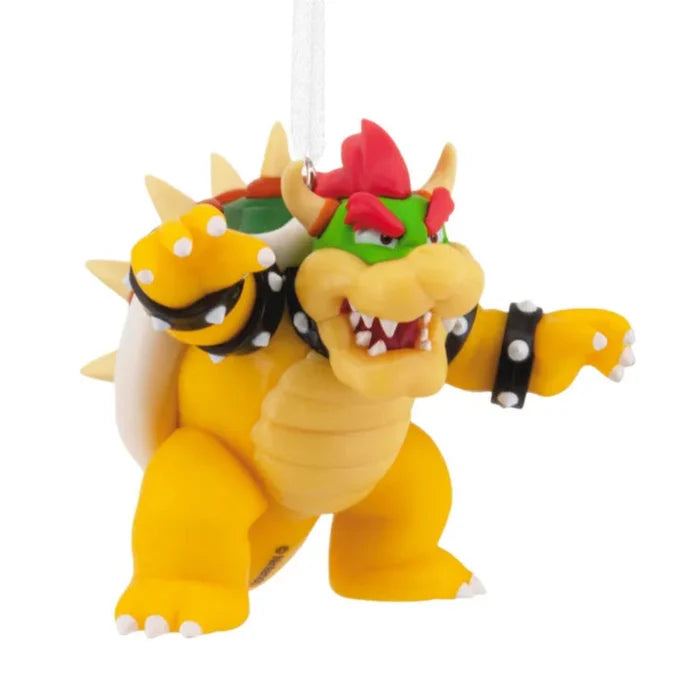 Toy figure of Bowser from Mario games on a white background