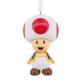 Character figurine with red and white cap on a white background