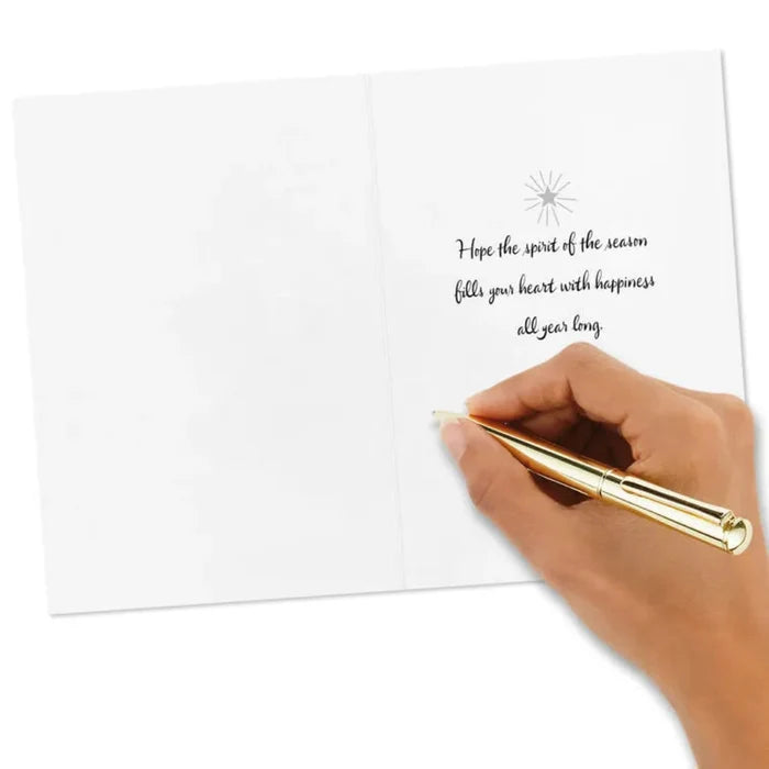 Hand writing on a card with a gold pen