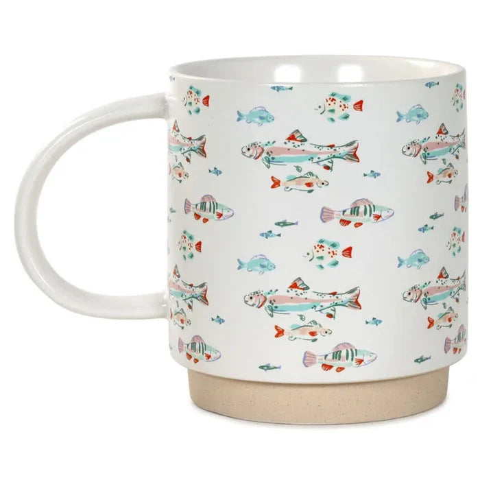 White mug with colorful fish pattern on a white background