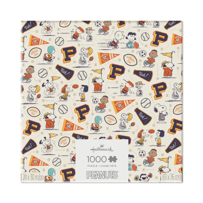 Peanuts-themed puzzle box with cartoon characters and sports elements on a beige background.