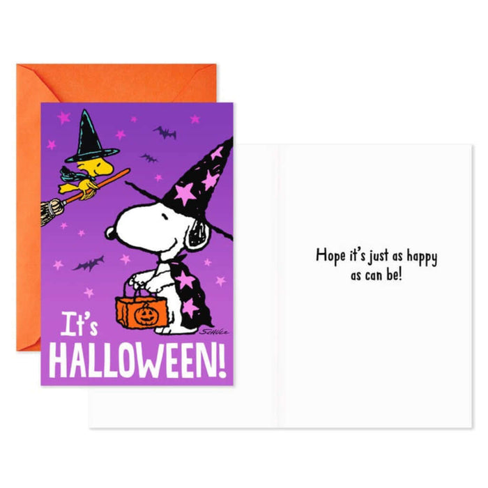 Halloween-themed greeting card with cartoon Snoopy and Woodstock  in witch costume and purple envelope.