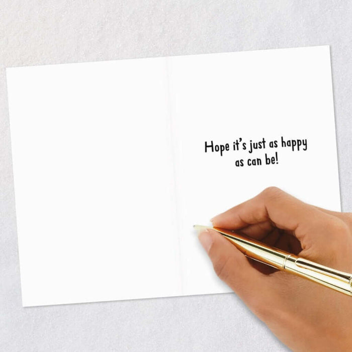 Handwritten message on a card with a gold pen