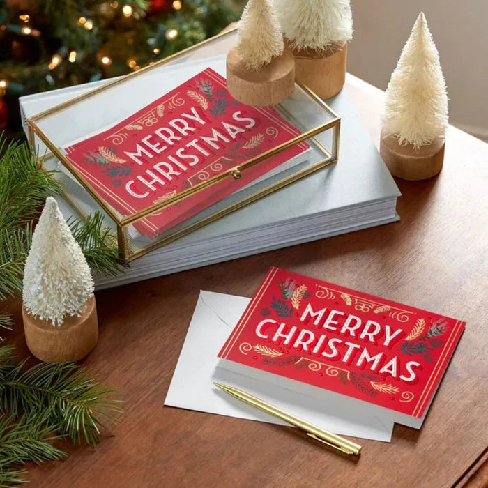Merry Christmas card with decorative elements on a wooden surface