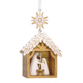 Decorative nativity scene ornament with a star on a white background