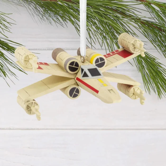 Detailed X-Wing Starfighter Christmas ornament from Star Wars  hanging from a tree