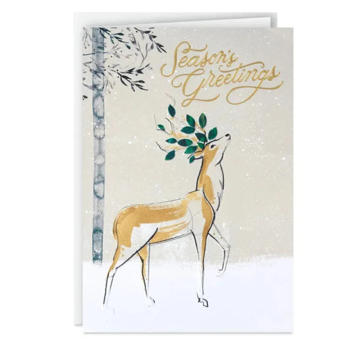 Greeting card with a deer illustration and 'Season's Greetings' text on a snowy background.