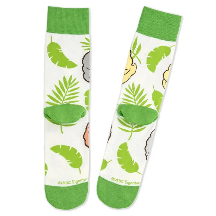 Pair of socks with green leaf  and Golden Girls patterns on a white background