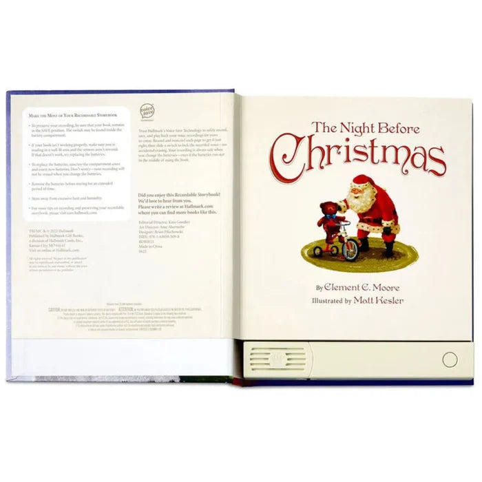 Open book titled 'The Night Before Christmas' with Santa Claus illustration on a white background