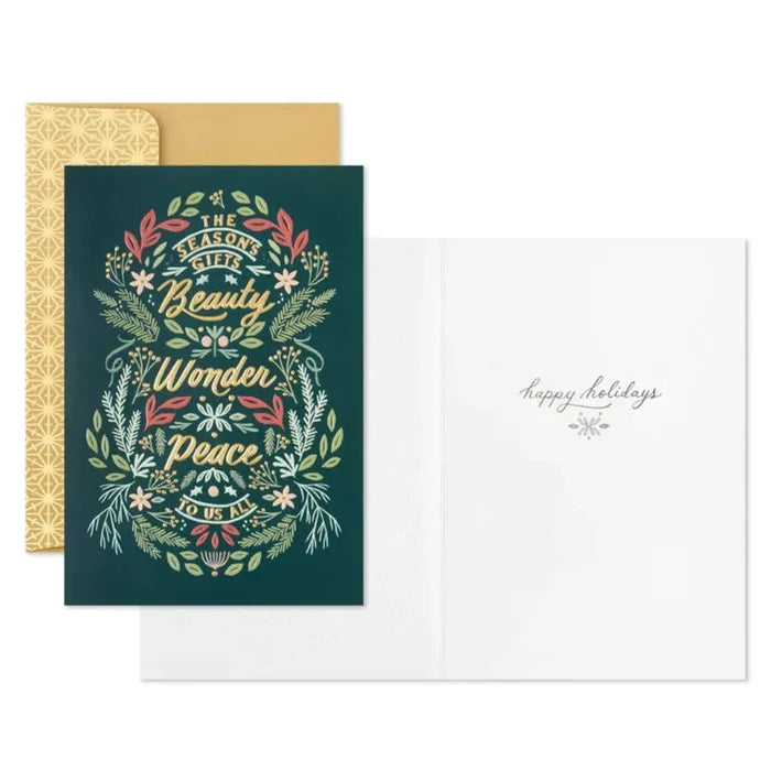 Holiday card with decorative wreath and text on a white background
