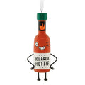 Decorative hot sauce bottle ornament with cartoon face and text 'You are a hottie' on a white background