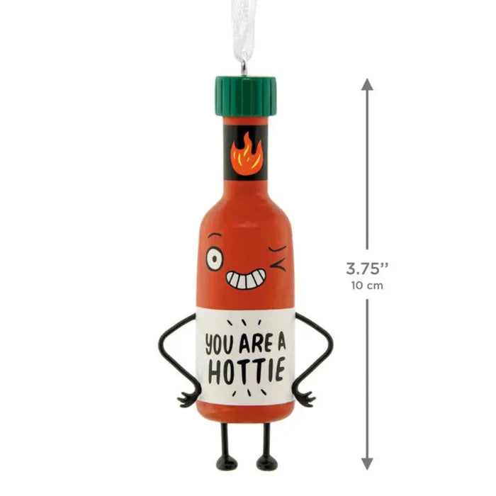 Hot sauce bottle ornament with cartoon face and text 'You are a hottie' on a white background