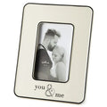 Cream photo frame with 'you & me' engraving holding a black and white photo of a couple.