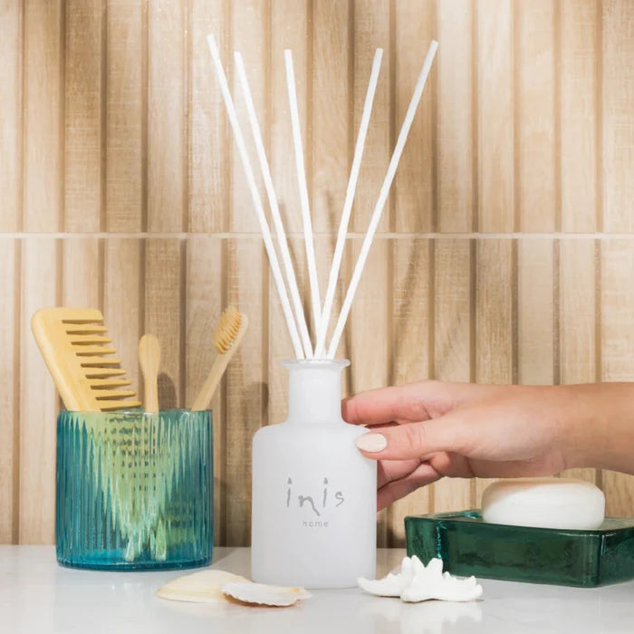 This elegant reed diffuser continuously releases the signature Inis fragrance, creating a clean, uplifting atmosphere without the need for flames or electricity.