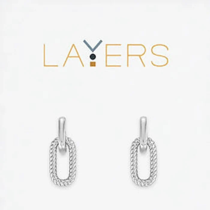 A pair of silver earrings featuring a delicate chain and a loop design, elegantly hanging from the earlobe.