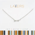 A silver chain necklace featuring a sleek silver pendant, elegantly designed for a modern look.