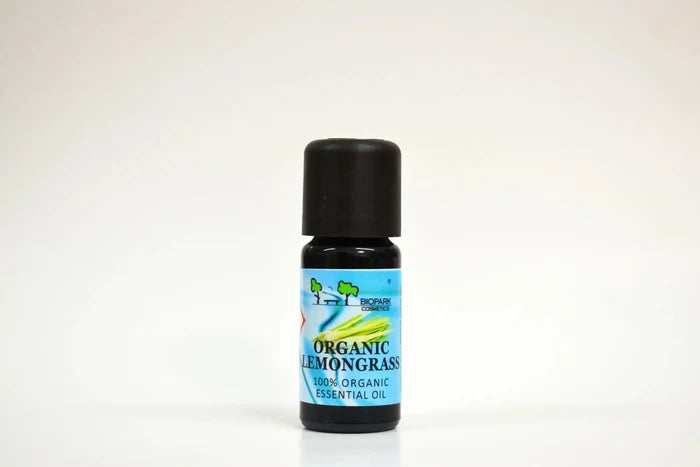 Bottle of organic lemongrass essential oil on a white background