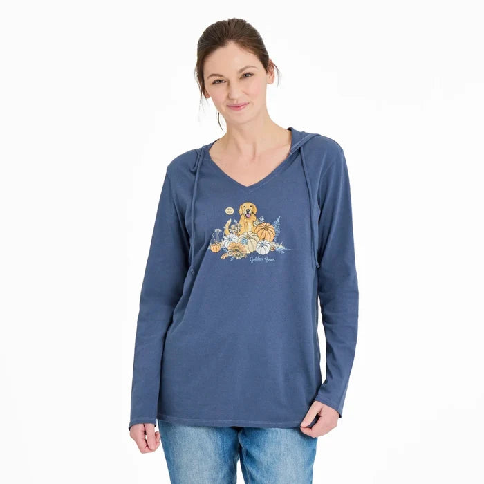 Woman wearing a blue hoodie with a graphic design on a white background