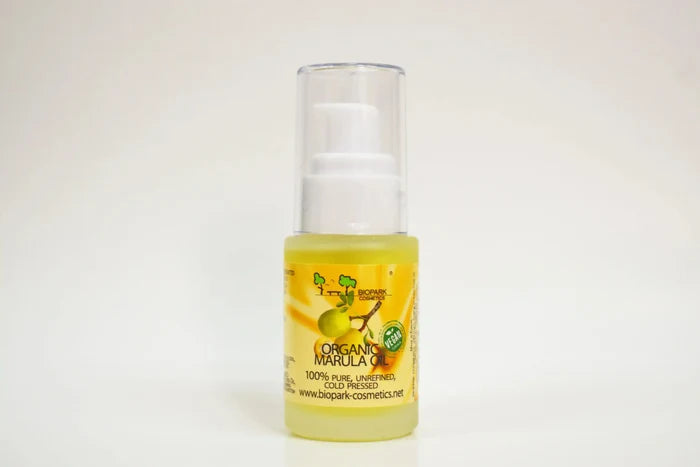 Bottle of organic marula oil on a white background