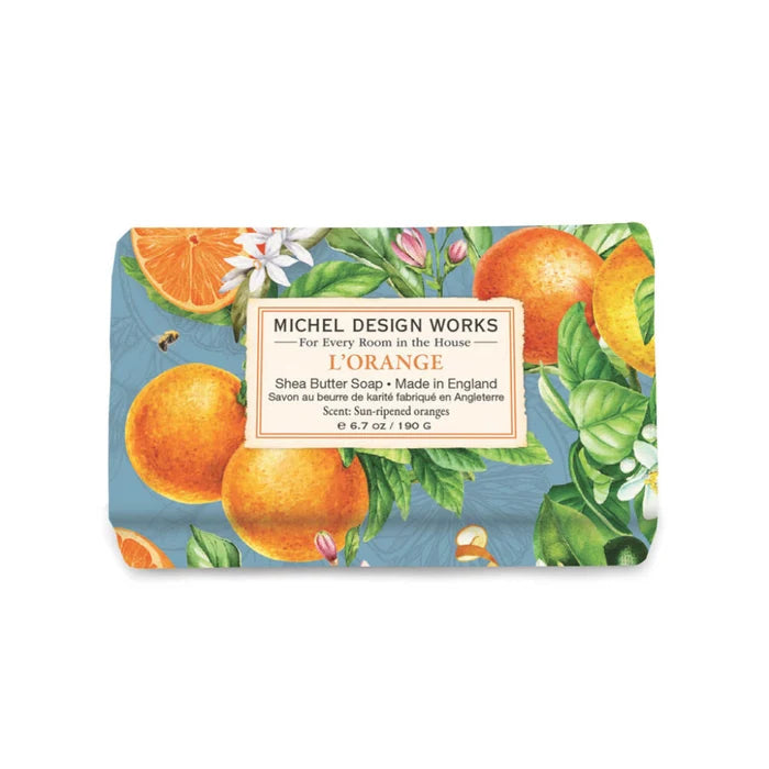Orange soap bar by Michelle Design Works, featuring a smooth texture and vibrant color, displayed on a neutral background.