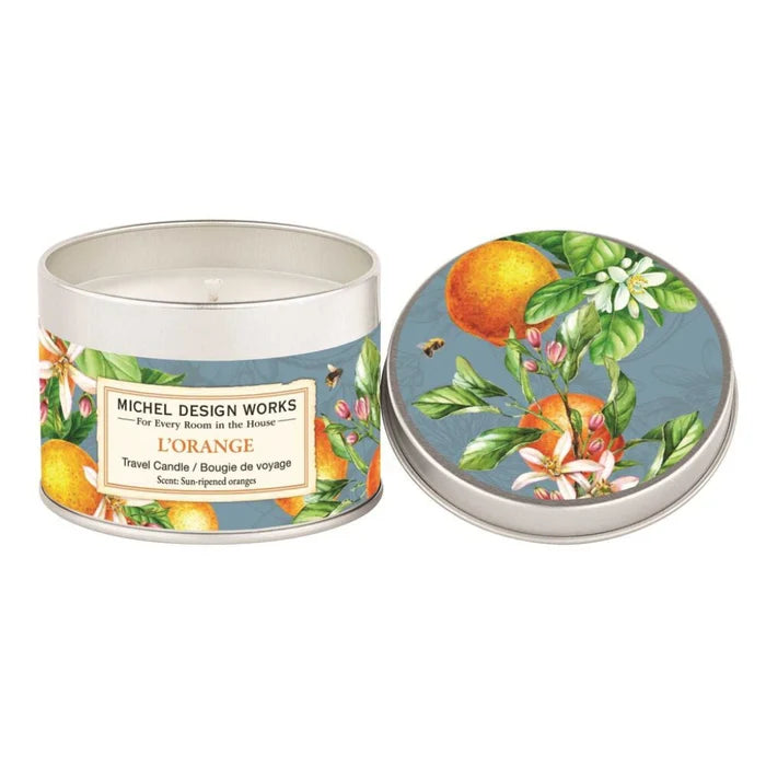 A decorative tin candle adorned with vibrant oranges and delicate flowers.