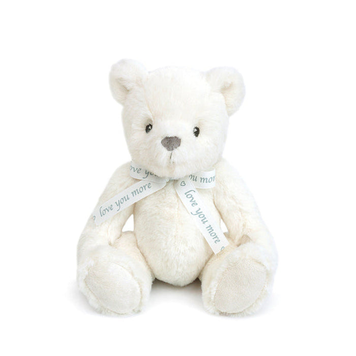 White teddy bear with a 'love you more' ribbon on a white background