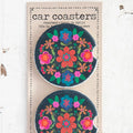 Two car magnets featuring vibrant floral designs in various colors and patterns.