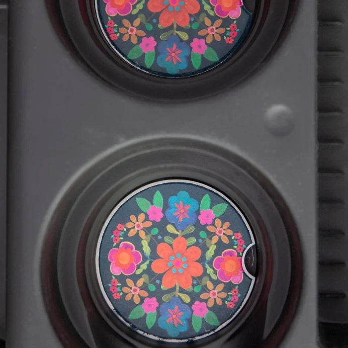 Two decorative car magnets adorned with colorful floral patterns.