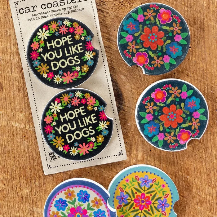 A pair of car magnets showcasing intricate floral designs in bright hues.