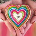 A ceramic ring dish inscribed with "I love you," designed for holding rings or small jewelry items.