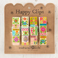 Colorful floral print clips arranged cheerfully on a light background, showcasing a vibrant and joyful design.