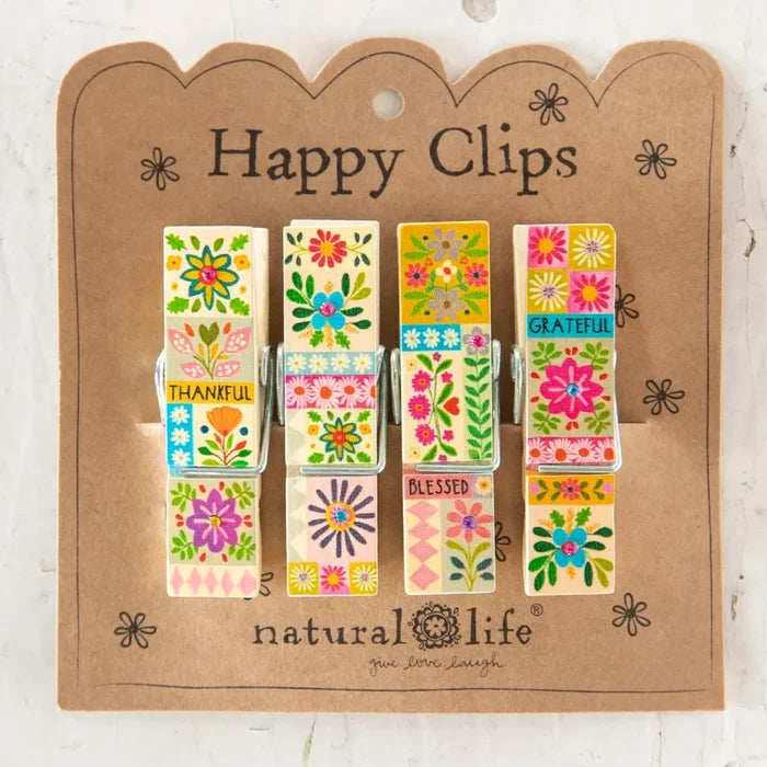 Colorful floral print clips arranged cheerfully on a light background, showcasing a vibrant and joyful design.