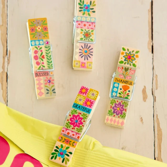 A collection of happy clips featuring a bright floral print, exuding a cheerful and lively aesthetic.