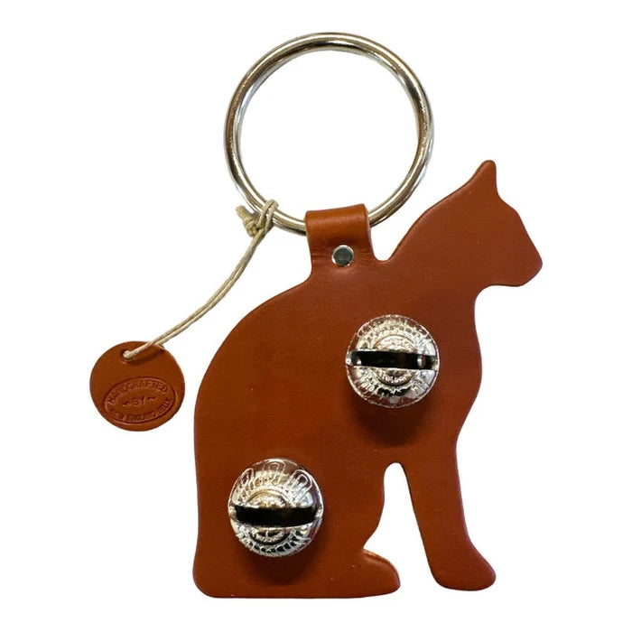 Cat-shaped keychain with bells on a white background