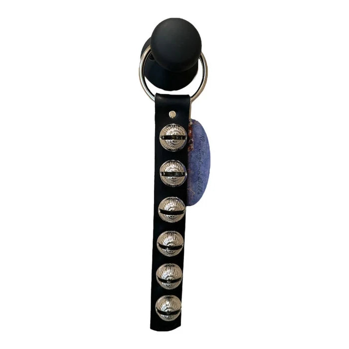 Black leather strap with silver buttons and a blue fabric patch on a white background